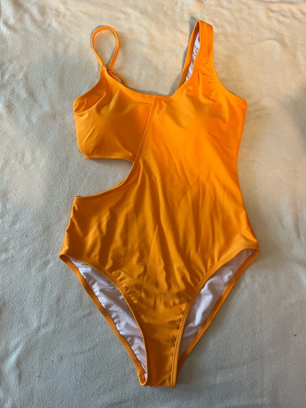 Orange ladies one piece asymmetrical side out 1 piece swimsuit size S